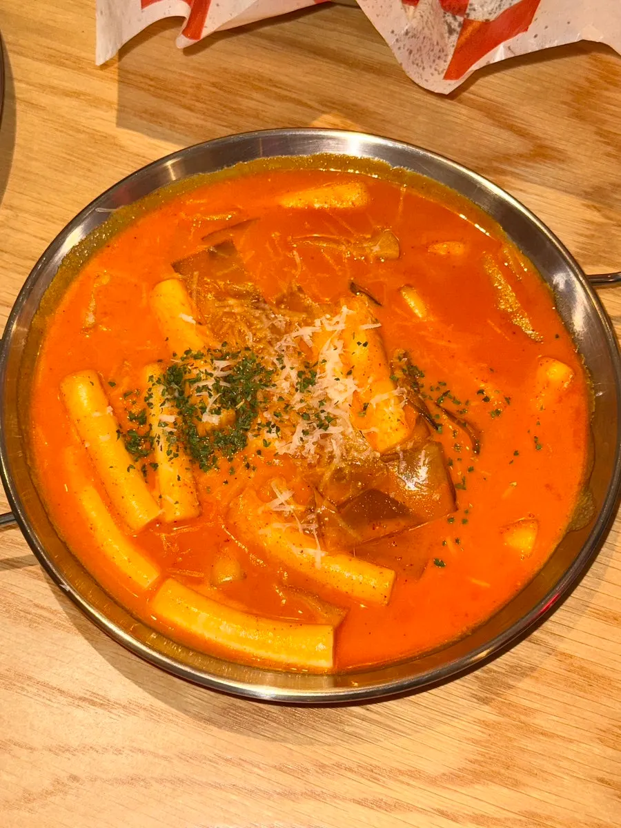 Close-up of soft rice cakes in rosé tteokbokki