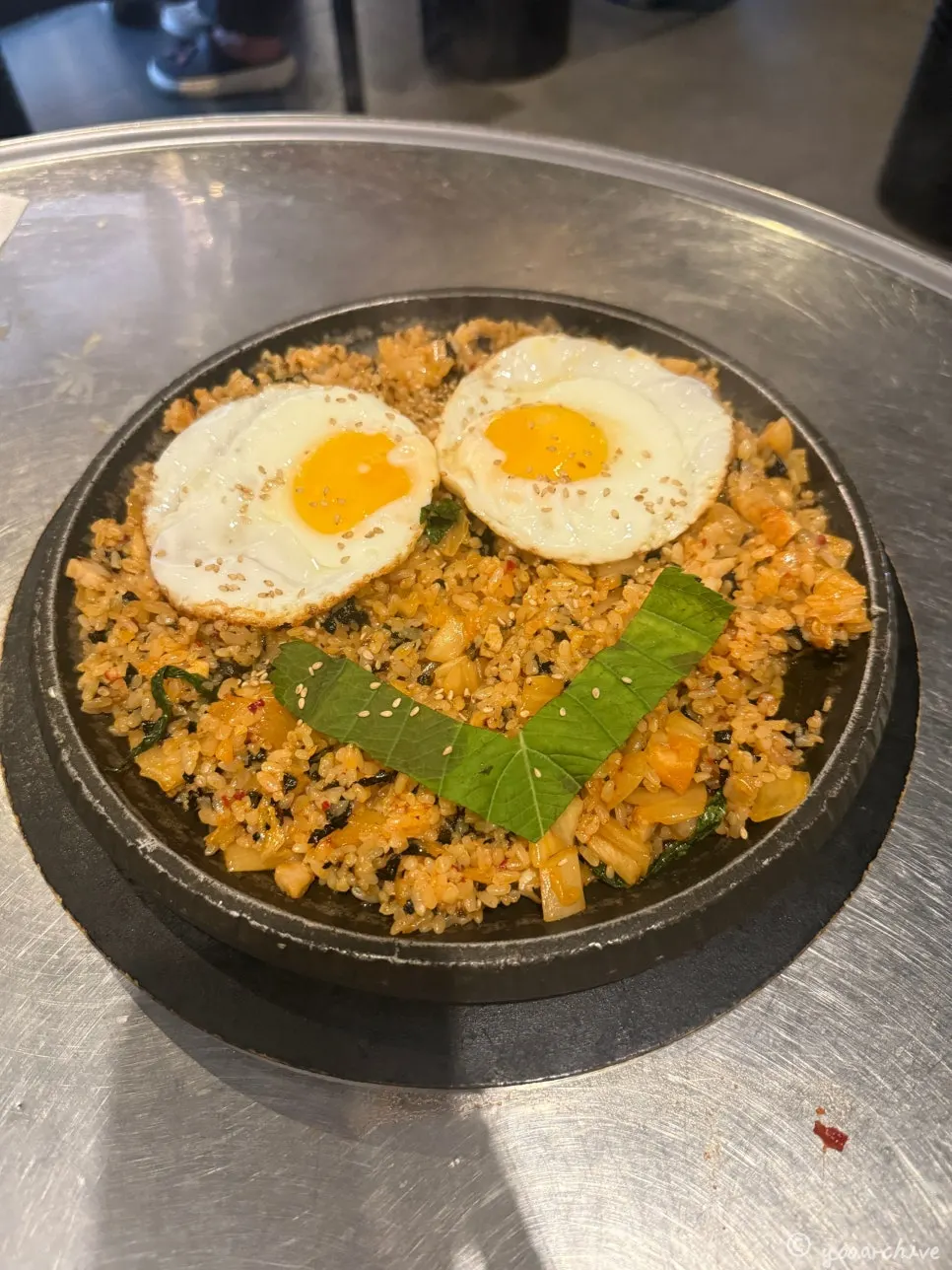 Two servings of yang bokkeumbap topped with two fried eggs