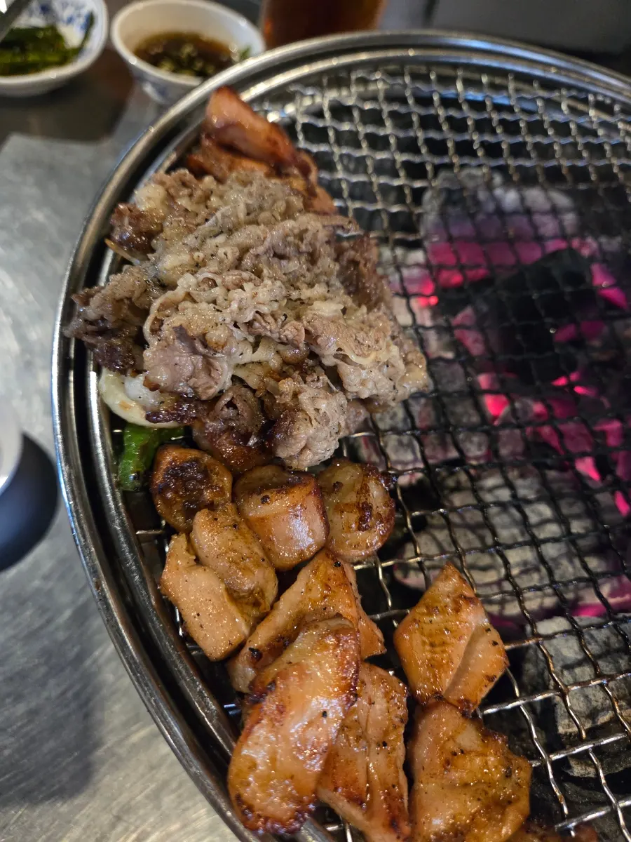 Grilled meat dipped in seasoned sauce