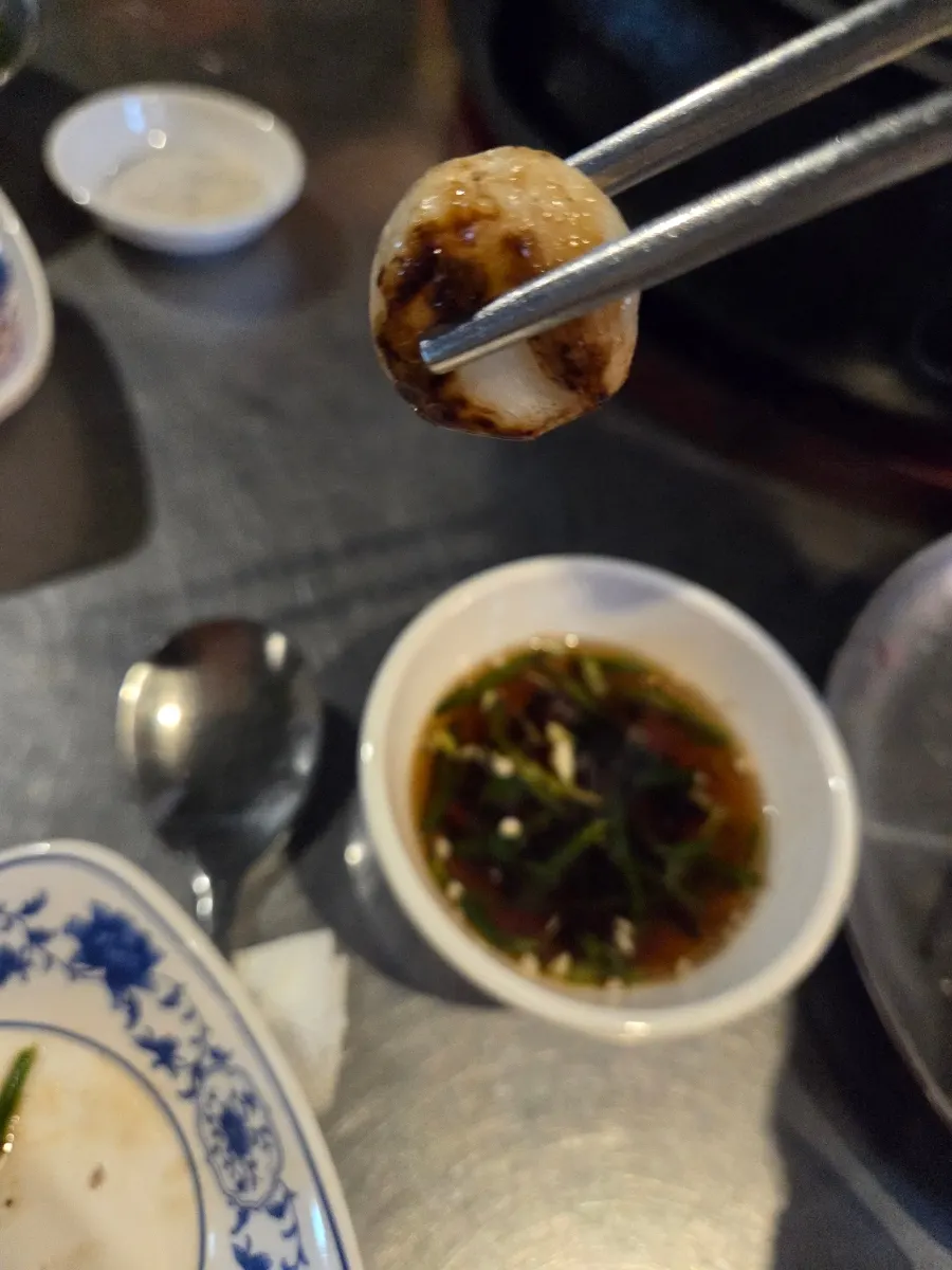 A slice of beef short rib with charcoal-smoked flavor