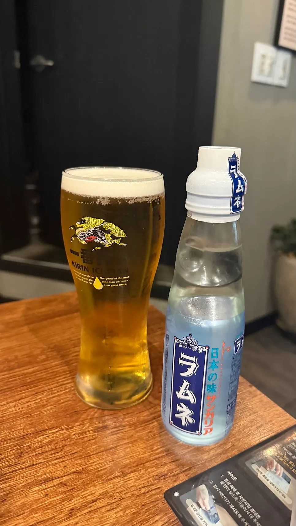 Kirin draft beer and ramune on the table