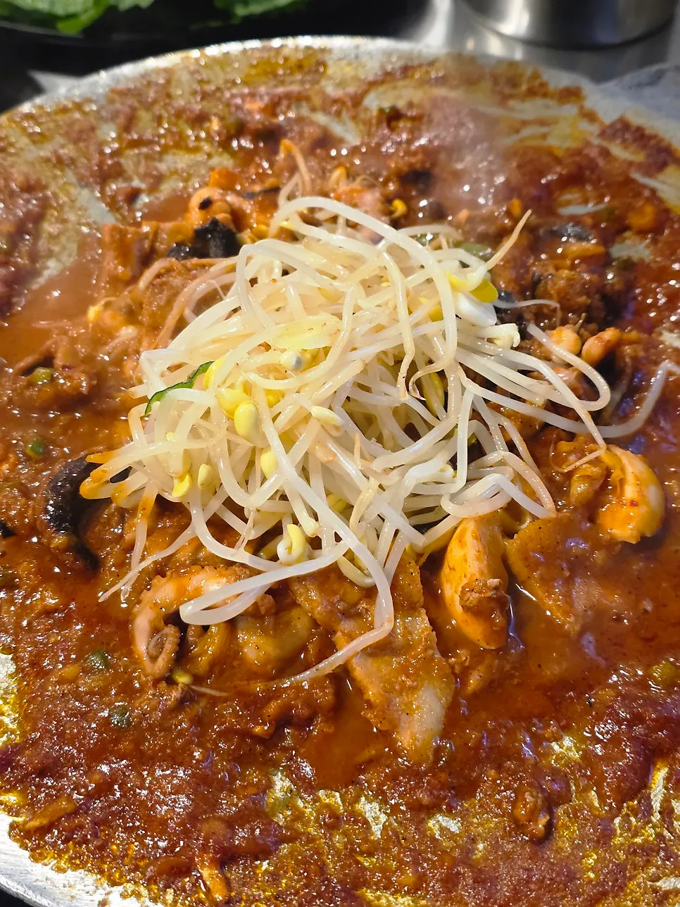 Stirring the hot plate octopus over low heat