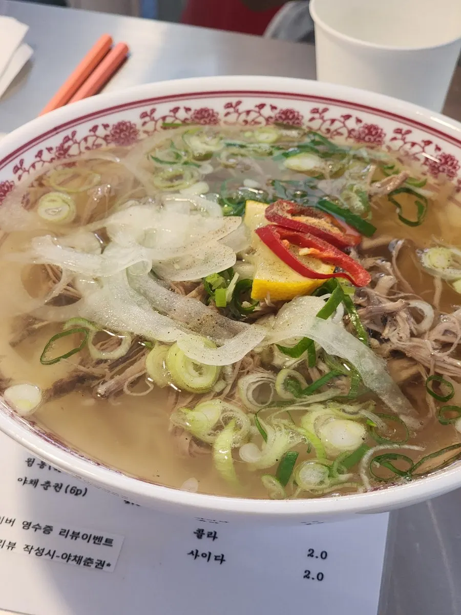 Springy noodles lifted from the brisket pho