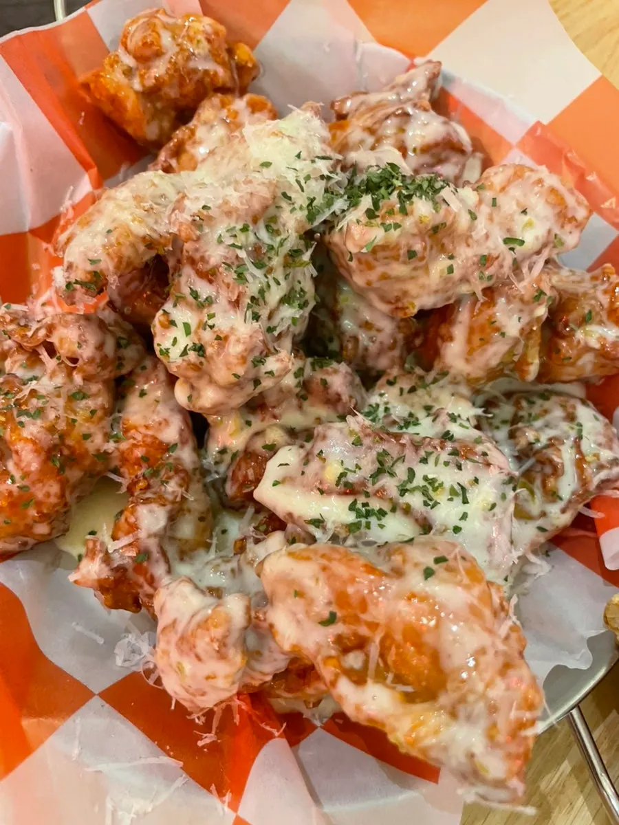 A slice of the spicy fusilli pizza