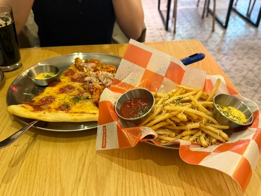Spicy fusilli and pepperoni pizza with beer order spread