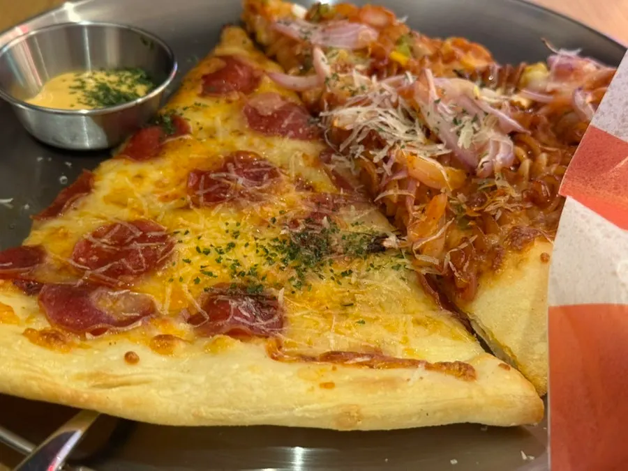 Raymond crispy pizza cut in half