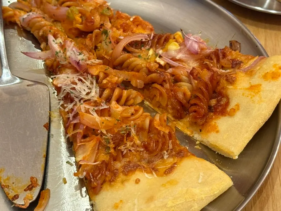 A slice of Raymond's spicy fusilli pizza