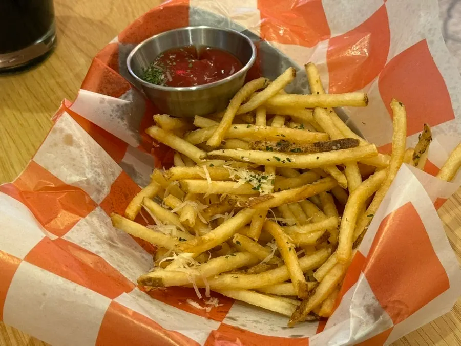 Truffle fries served alongside craft beer