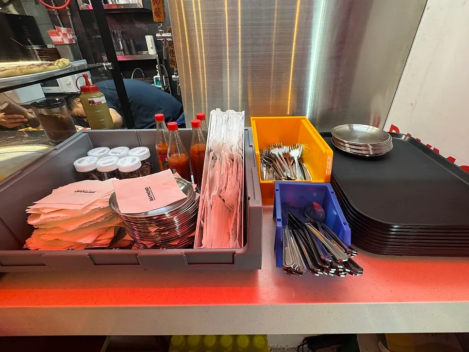 Pizzas on display in the case