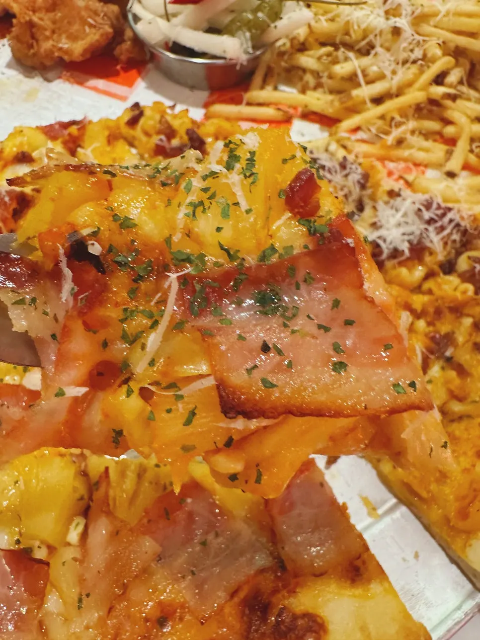 Close-up of the bacon hawaiian slice pizza
