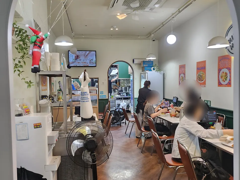 A full dining room at Italian Madam Main Branch in the evening