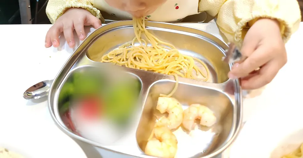 A nearly finished plate of shrimp aglio olio