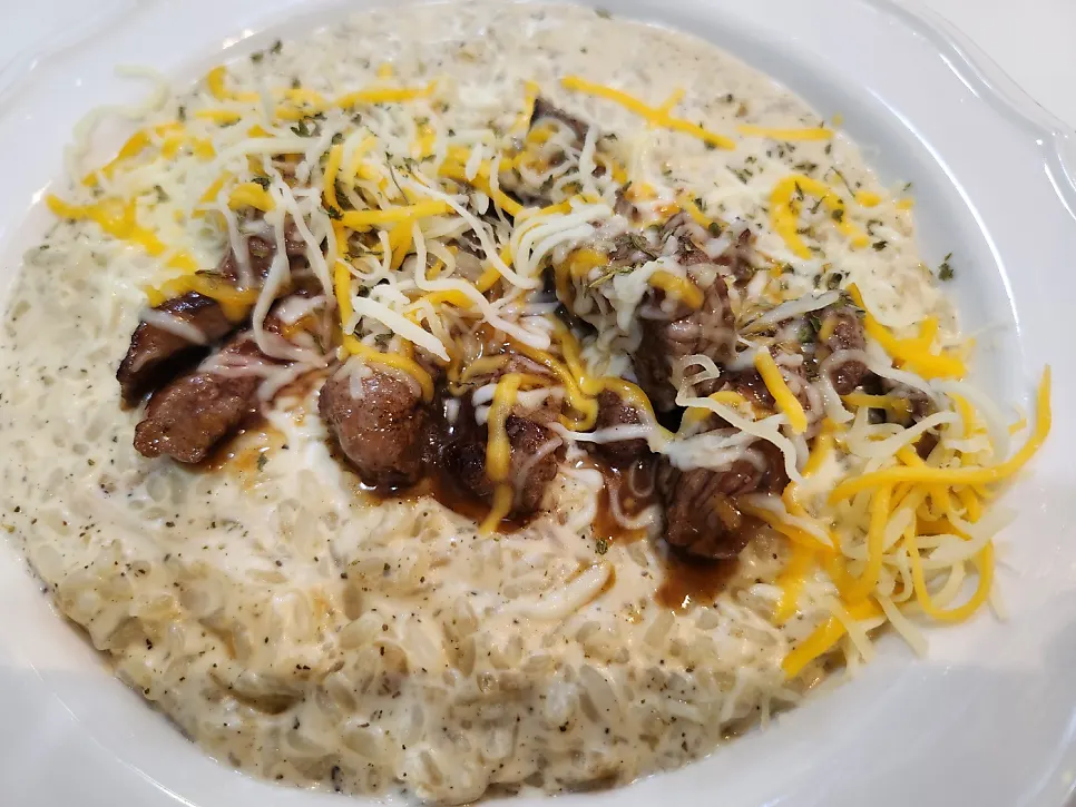 A bowl of beef flap steak cream risotto