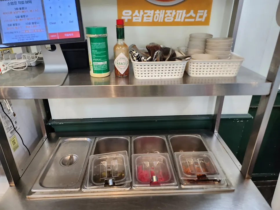 Self-serve bar with pickles and utensils