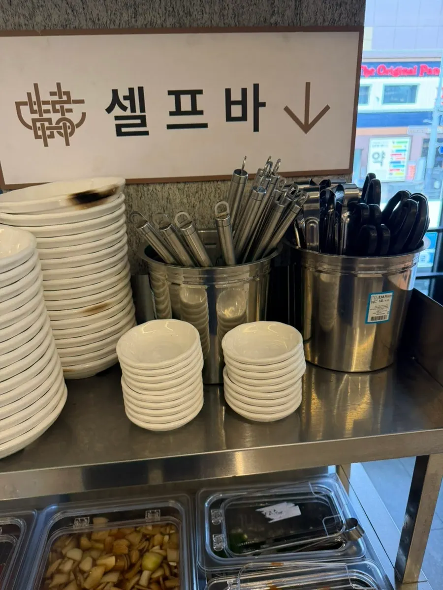 Utensils and side dish containers at the self-bar
