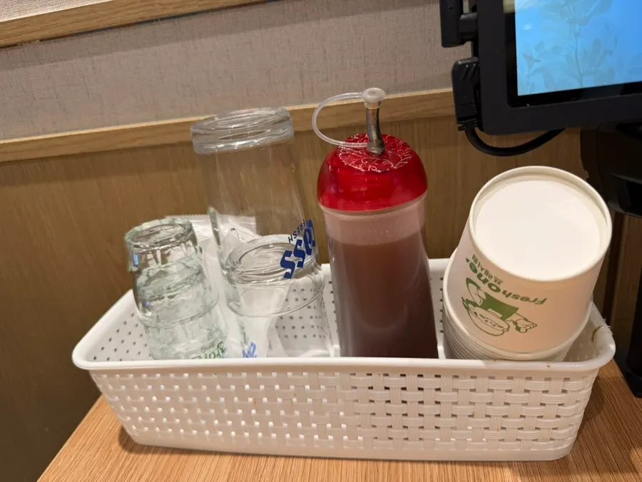 Paper cups, soju glasses, and meat dipping sauce