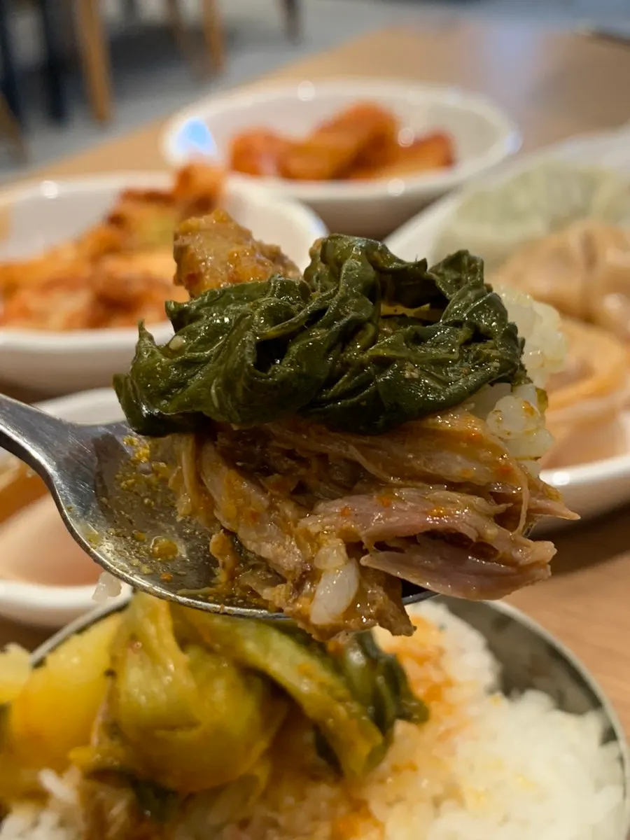 Rice topped with gamjatang radish greens and broth