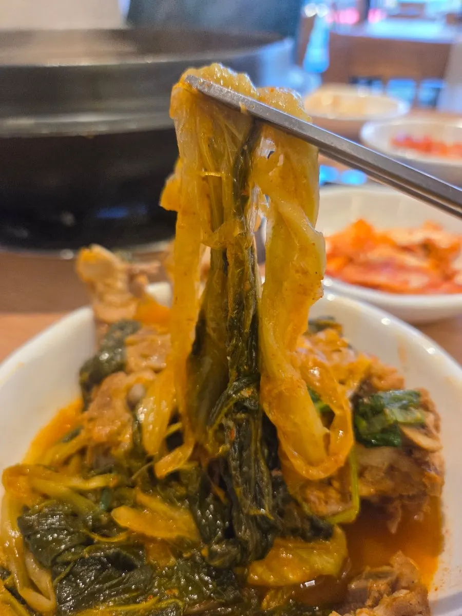 Radish greens and bone meat picked up together