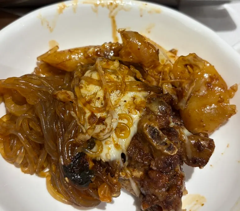 Glass noodles and add-ins soaked in soy sauce seasoning