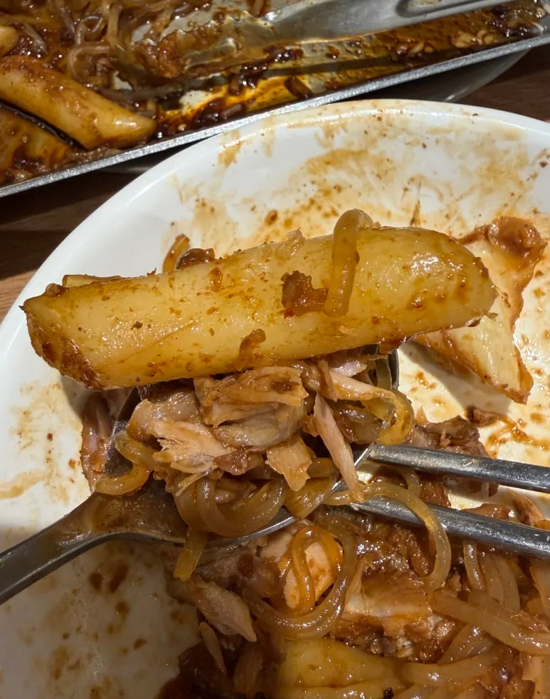 Soy sauce braised pork bones with rice cakes, sujebi, and glass noodles