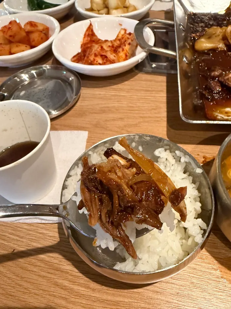 A generous layer of cheese over braised pork bones