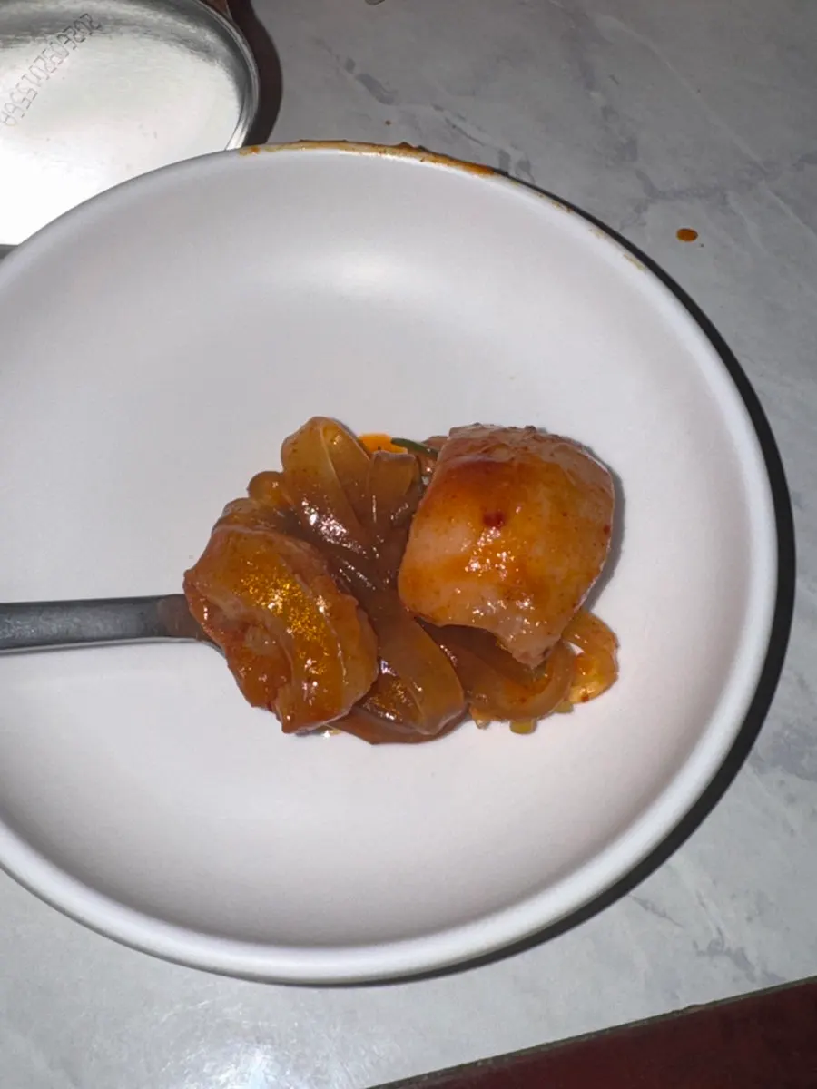 Close-up of the rich, deep red broth of padoritang