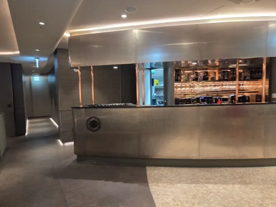 Floor-to-ceiling glass entrance and black-and-white exterior