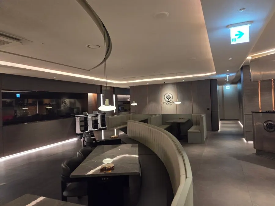 Interior of Modam Itaewon's dining hall with wide table spacing