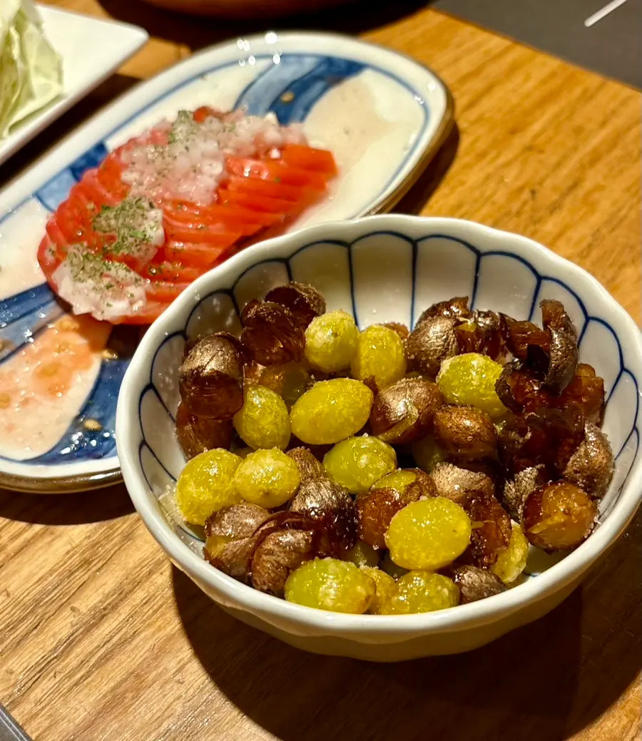 Half-size tomato salad topped with onion