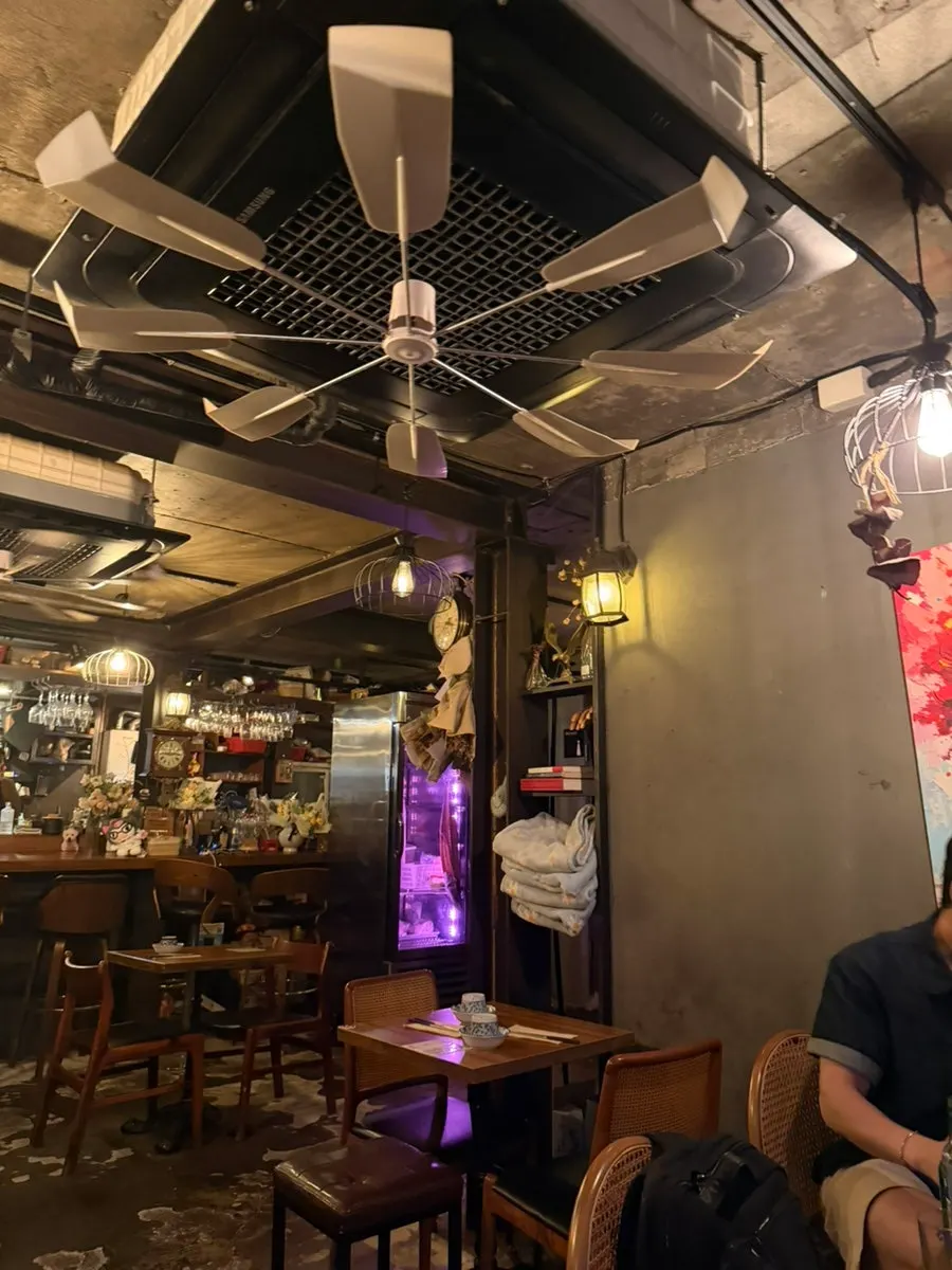 Spacious interior of Kuroiya with many tables