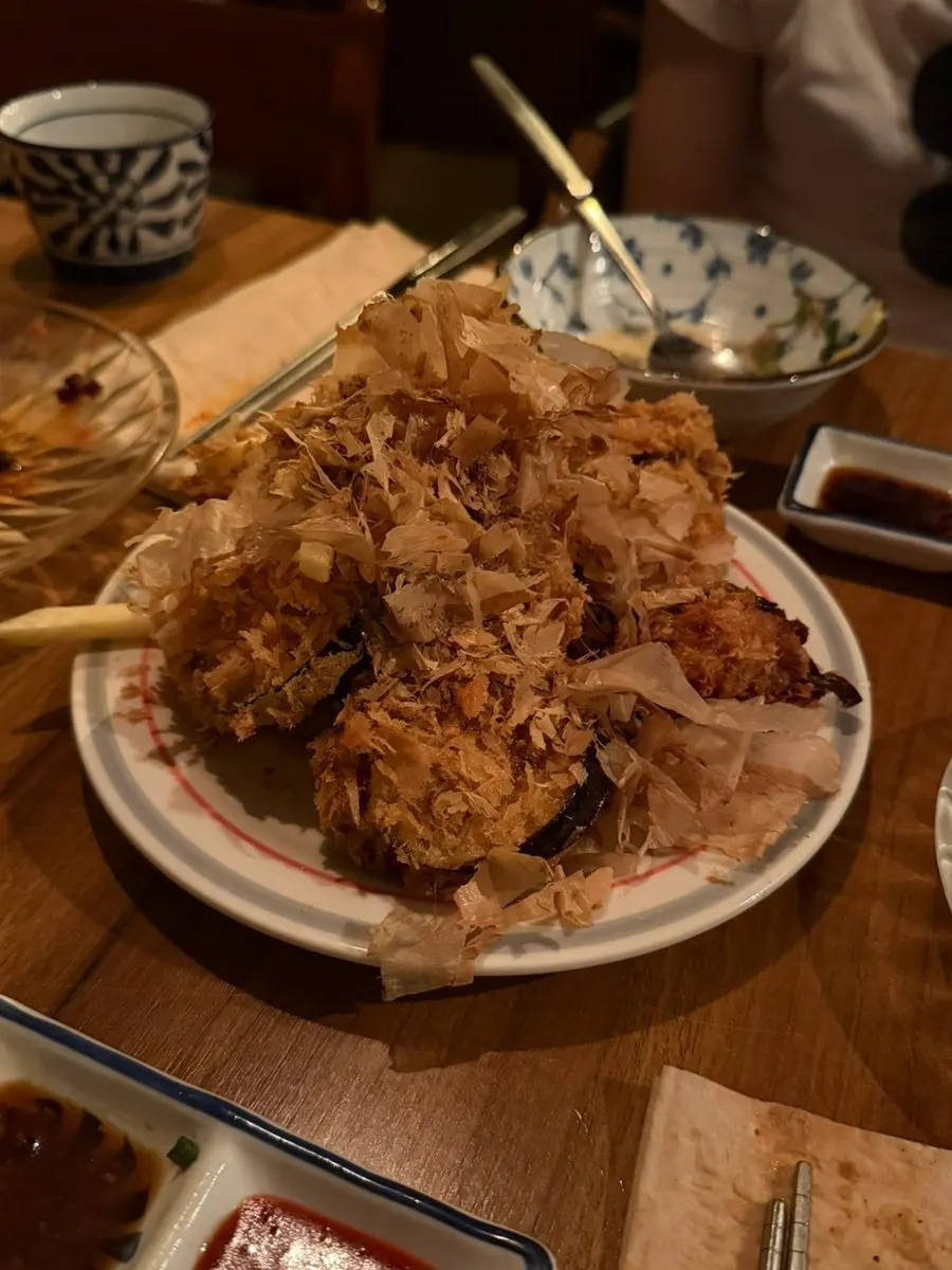 Sample sake served in a fish-shaped cup