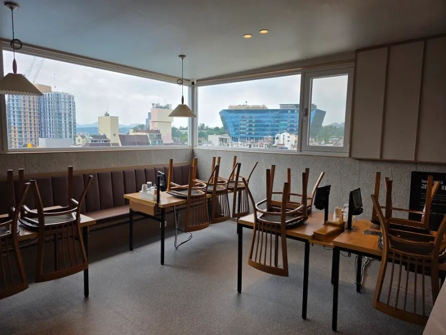 View into the spotless white kitchen inside the restaurant