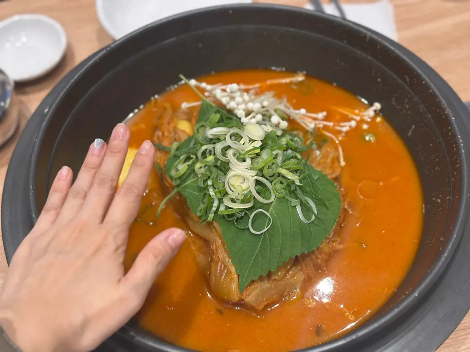 Medium aged kimchi bone stew served in a large pot