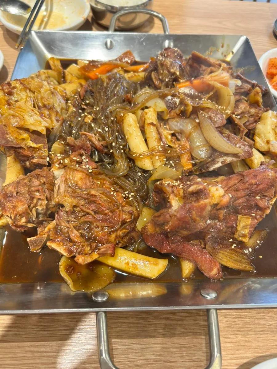Gamjatang broth served alongside the soy-braised bone stew
