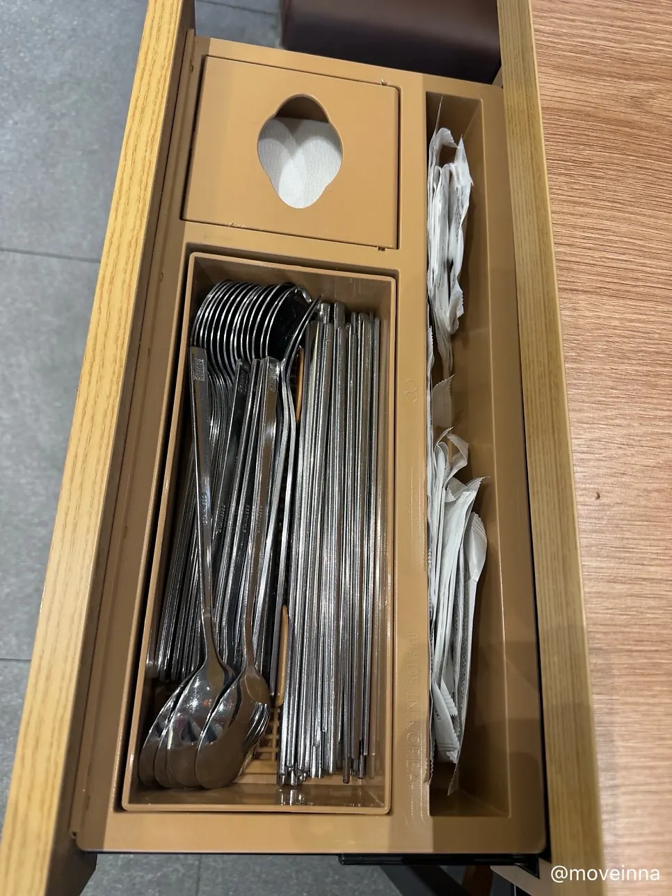Table drawer with utensils and tissues
