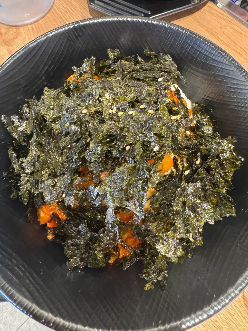 Self-serve fried rice served with seaweed flakes and kimchi