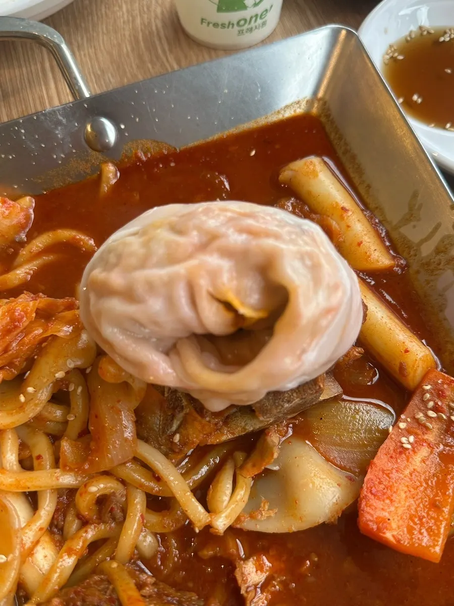 Cross-section of a kimchi dumpling showing the packed filling