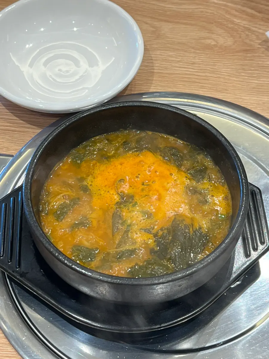 Gamjatang broth served alongside the bone stew