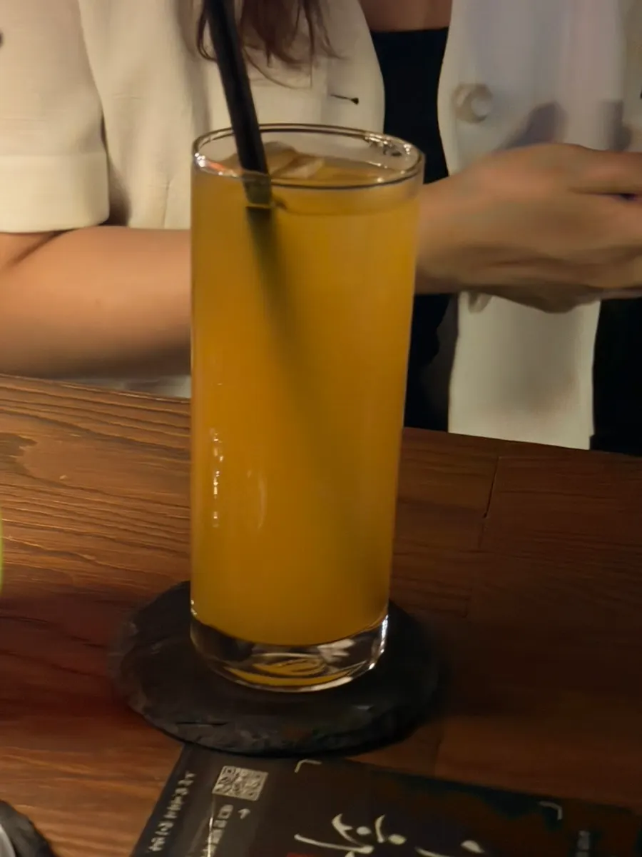A glass of Peach Crush cocktail