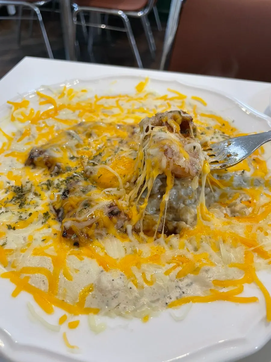 Pork neck cream risotto topped with mozzarella cheese
