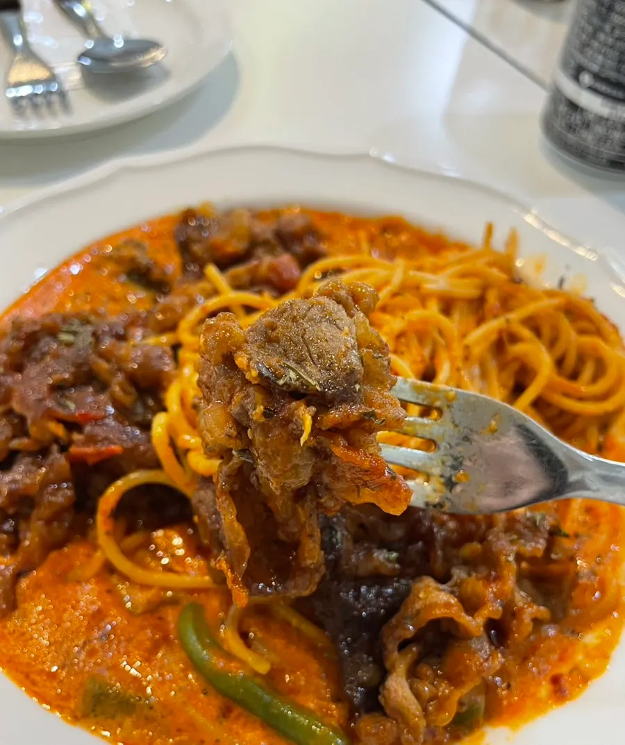 Fork twirling the woosamgyeop mala rosé pasta noodles