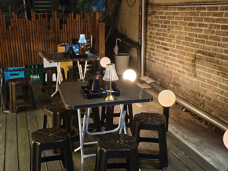 Outdoor seating view overlooking the Yeonnam-dong alley
