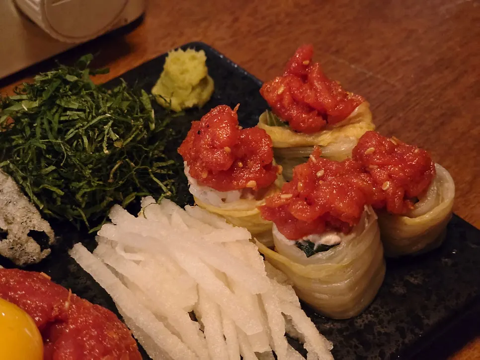 Jeolla-style red-hued yukhoe topped with egg yolk