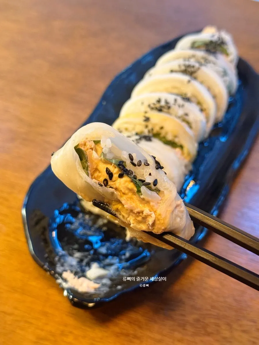 Close-up of aged kimchi tuna roll packed with tuna