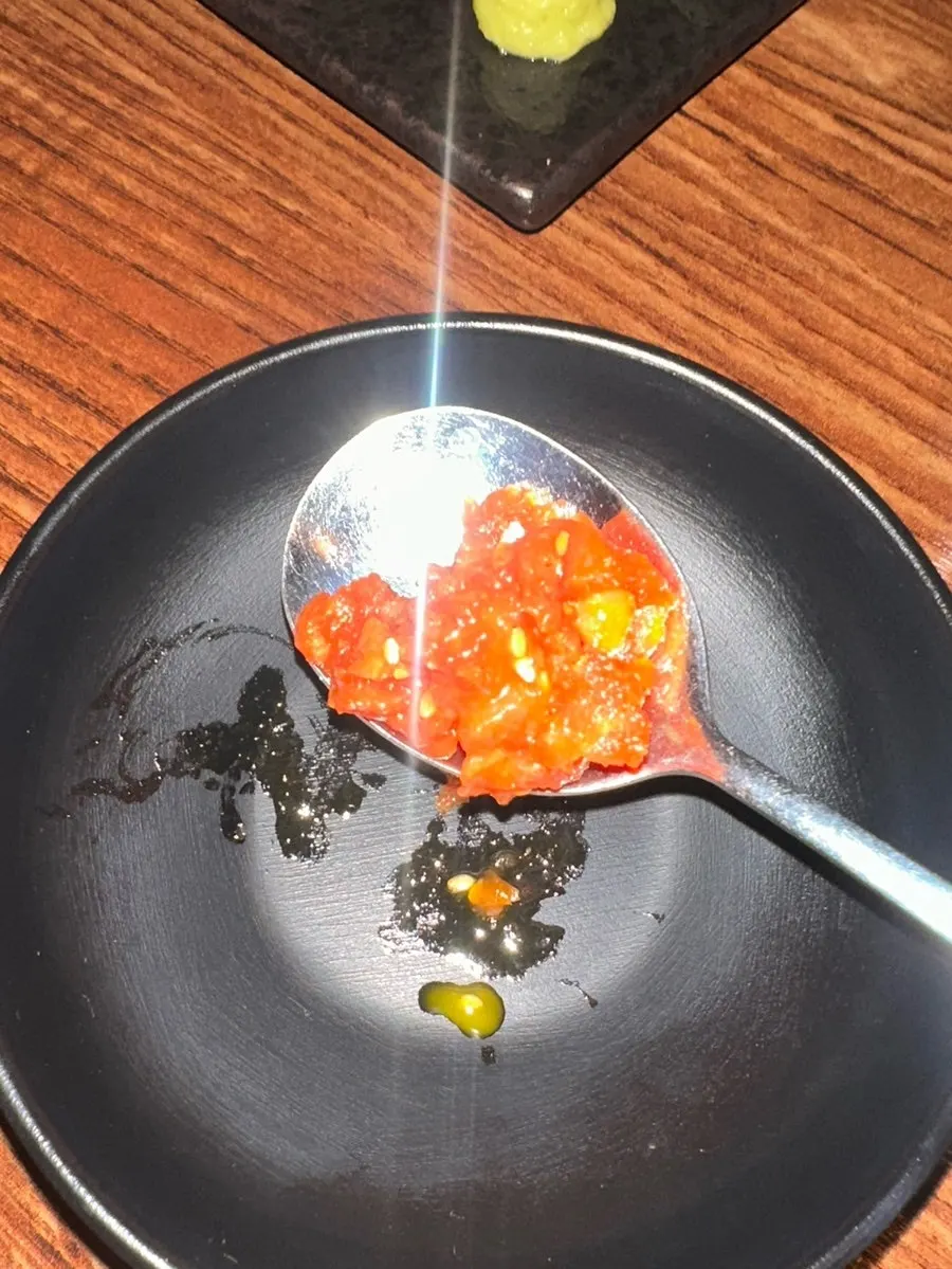 Gochujang-marinated yukhoe with pear and perilla leaf on the side