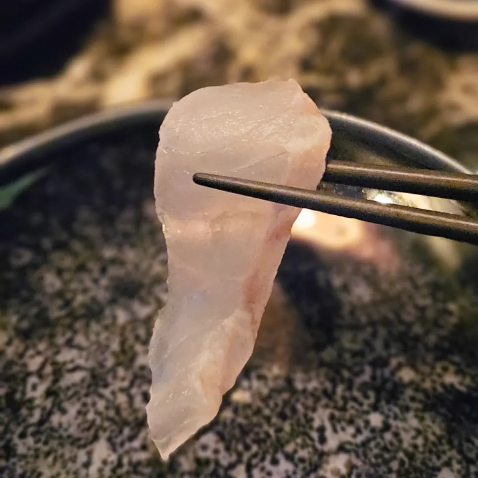Cross-section of salt gimbap topped with aged halibut