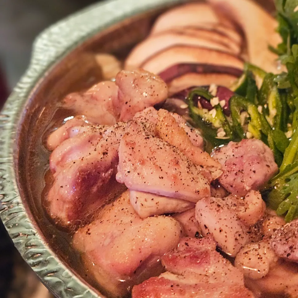 Mizutaki broth simmering with mushrooms