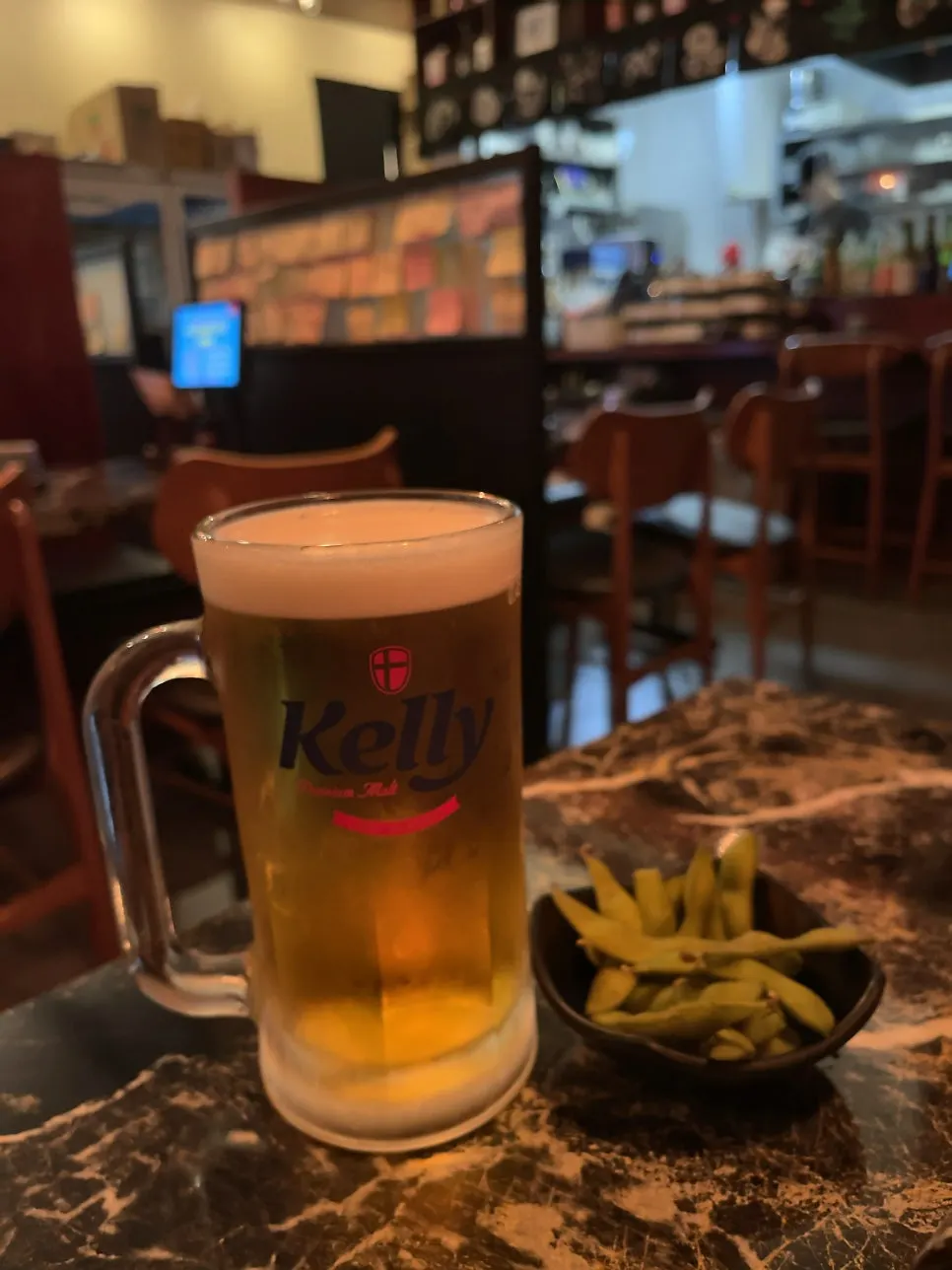 Draft Kelly beer and edamame side dish at Ito