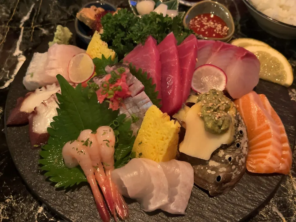 A piece of sashimi before dipping in soy sauce