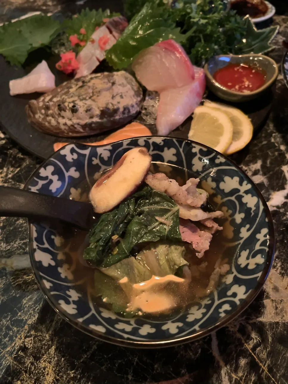 Broth of the mille-feuille nabe coming to a boil